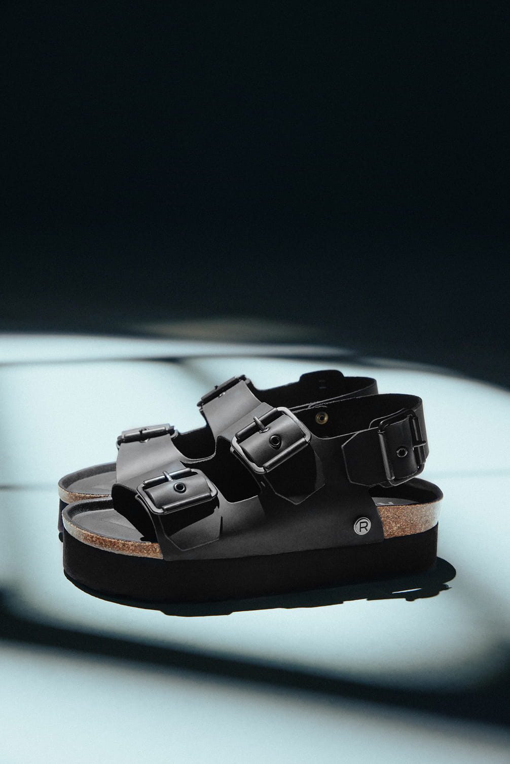 Black platform sandals with silver buckles